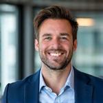Professional photo of a smiling Canadian payroll expert, diverse.