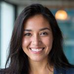 Professional photo of a smiling client success manager, diverse.
