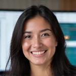 Professional photo of a smiling technical support specialist, diverse.